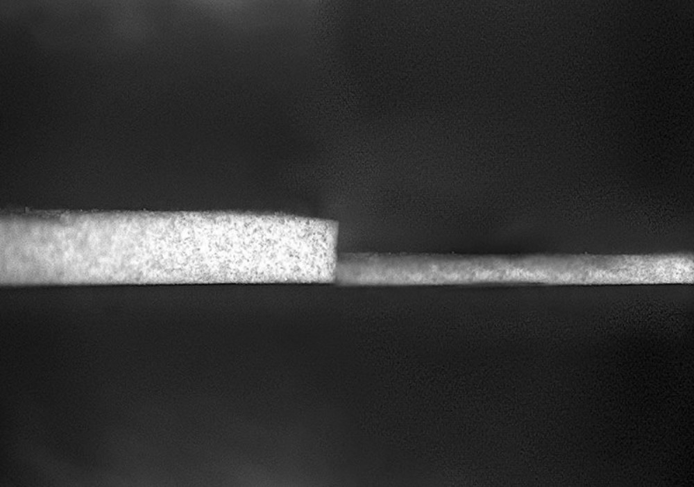 Purdue University researchers have created a new formula for the world's whitest paint, making it thinner and lighter. The previous iteration (left) required a layer 0.4 millimeters thick to achieve sub-ambient radiant cooling. The new formulation can achieve similar cooling with a layer just 0.15 millimeters thick. This is thin and light enough for its radiant cooling effects to be applied to vehicles like cars, trains and airplanes. (Purdue University photo/Andrea Felicelli)